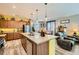 Stylish kitchen with an island featuring stainless steel appliances, and opens into the living area at 6322 Highledge St, North Las Vegas, NV 89081