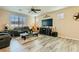 Inviting living room featuring hardwood floors and bright windows at 6322 Highledge St, North Las Vegas, NV 89081