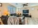 Inviting living room featuring hardwood floors and bright windows at 6322 Highledge St, North Las Vegas, NV 89081