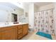 Clean bathroom with double vanity and shower/tub combo at 5855 Valley Dr # 1028, North Las Vegas, NV 89031