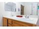 Bright bathroom with double sinks and a large mirror at 5855 Valley Dr # 1028, North Las Vegas, NV 89031