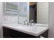 Modern bathroom with a single sink and white countertop at 5855 Valley Dr # 1028, North Las Vegas, NV 89031