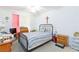 Bedroom with a striped comforter and ceiling fan at 5855 Valley Dr # 1028, North Las Vegas, NV 89031