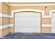 Attached single car garage with white door at 5855 Valley Dr # 1028, North Las Vegas, NV 89031