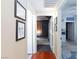 Well-lit hallway with hardwood floors and framed pictures at 5855 Valley Dr # 1028, North Las Vegas, NV 89031
