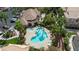 Community pool and spa with surrounding landscaping at 5855 Valley Dr # 1028, North Las Vegas, NV 89031