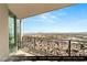 Balcony with wrought iron railing, furniture, and a beautiful city view at 9101 Alta Dr # 1202, Las Vegas, NV 89145