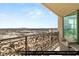 Balcony shared between the living room and guest bedroom with wrought iron railing and city view at 9101 Alta Dr # 1202, Las Vegas, NV 89145