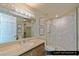 Guest bathroom featuring vanity, shower, and glass door at 9101 Alta Dr # 1202, Las Vegas, NV 89145