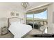 Bright bedroom with city and mountain views, featuring sliding glass doors to private balcony at 9101 Alta Dr # 1202, Las Vegas, NV 89145