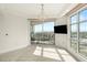 Guest bedroom with large windows, balcony, and chandelier at 9101 Alta Dr # 1202, Las Vegas, NV 89145