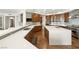 Spacious kitchen with white countertops, wood floors, wood cabinets, tile backsplash, and stainless steel appliances at 9101 Alta Dr # 1202, Las Vegas, NV 89145