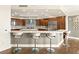 Modern kitchen with stainless steel appliances, a breakfast bar, and custom cabinets at 9101 Alta Dr # 1202, Las Vegas, NV 89145