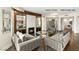 Open-concept living room with hardwood flooring, stylish furniture, and a modern fireplace at 9101 Alta Dr # 1202, Las Vegas, NV 89145