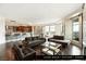 Spacious living room open to the kitchen and dining areas, with hardwood floors and city views at 9101 Alta Dr # 1202, Las Vegas, NV 89145