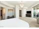 Spacious main bedroom with chandelier, seating area, and access to a private balcony at 9101 Alta Dr # 1202, Las Vegas, NV 89145