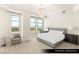 Bright bedroom with cityscape views, modern decor, plush carpet and a chandelier at 9101 Alta Dr # 1202, Las Vegas, NV 89145