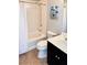 Clean bathroom with a bathtub and dark vanity at 8255 Las Vegas Blvd # 1819, Las Vegas, NV 89123