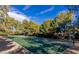 Community basketball court with trees under blue sky on a sunny day at 9809 Miss Peach Ave, Las Vegas, NV 89145