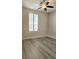 Sunlit bedroom with a shuttered window and neutral walls at 9809 Miss Peach Ave, Las Vegas, NV 89145