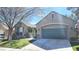 Charming single-story house featuring a two-car garage and well-maintained lawn at 9809 Miss Peach Ave, Las Vegas, NV 89145