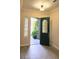 Home foyer featuring hard wood floors, teal door and side light window at 9809 Miss Peach Ave, Las Vegas, NV 89145