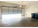 This is a spacious garage with an automatic door at 9809 Miss Peach Ave, Las Vegas, NV 89145