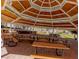 A community outdoor kitchen area with tables and grill at 9809 Miss Peach Ave, Las Vegas, NV 89145