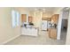 Bright kitchen with granite countertops, white appliances, and ample cabinet space at 9809 Miss Peach Ave, Las Vegas, NV 89145