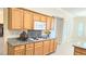 Well-lit kitchen featuring granite counters, ample cabinets, and modern appliances at 9809 Miss Peach Ave, Las Vegas, NV 89145