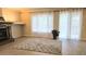 Beautiful living room featuring a fireplace and large windows at 9809 Miss Peach Ave, Las Vegas, NV 89145