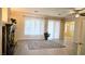 Bright living room with wood floors, fireplace, and large bright windows at 9809 Miss Peach Ave, Las Vegas, NV 89145