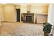 Bright living room with a fireplace, a patterned rug, and neutral color scheme at 9809 Miss Peach Ave, Las Vegas, NV 89145