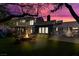 Backyard with covered patio, fire pit, seating, and ample room for recreation and entertaining at 7135 Polaris Ave, Las Vegas, NV 89118