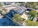 An aerial view showcasing the home's solar panels, large patio, and verdant backyard at 7135 Polaris Ave, Las Vegas, NV 89118