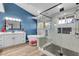 Stylish primary bathroom with a freestanding tub, walk-in shower with a glass door, and modern fixtures at 7135 Polaris Ave, Las Vegas, NV 89118