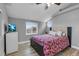 Bedroom featuring a decorative window, television, and cozy bedding at 7135 Polaris Ave, Las Vegas, NV 89118