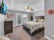 Bedroom featuring a ceiling fan, exterior doors to the balcony, and neutral color scheme at 7135 Polaris Ave, Las Vegas, NV 89118