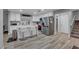 Beautiful, modern kitchen with white cabinets, marble countertop island, and stainless steel appliances at 7135 Polaris Ave, Las Vegas, NV 89118