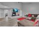 Cozy living room featuring a fireplace, modern decor, gray walls and hardwood floors at 7135 Polaris Ave, Las Vegas, NV 89118