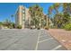 Lovely building exterior with well-maintained parking and landscaping at 750 S Royal Crest Cir # 353, Las Vegas, NV 89169