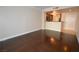 Hardwood floor living room with kitchen and entry views at 270 E Flamingo Rd # 107, Las Vegas, NV 89169