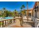 Balcony overlooking the community pool and lush landscaping at 270 E Flamingo Rd # 107, Las Vegas, NV 89169