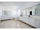 Bright bathroom featuring a large soaking tub, double vanities, and sleek modern fixtures at 510 Duvet Ct, Henderson, NV 89012