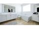 Stylish bathroom showcasing a standalone tub, modern vanity, and large mirror at 510 Duvet Ct, Henderson, NV 89012