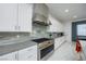 Sleek kitchen with stainless steel range and white cabinets at 510 Duvet Ct, Henderson, NV 89012