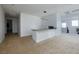 Second-floor living area with a wet bar and neutral carpet at 510 Duvet Ct, Henderson, NV 89012