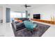 Modern living room featuring a comfortable seating arrangement, sleek decor, and ample natural light at 510 Duvet Ct, Henderson, NV 89012