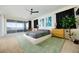 Spacious main bedroom with a ceiling fan, balcony access, and modern decor at 510 Duvet Ct, Henderson, NV 89012