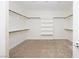 Spacious walk-in closet with shelving and rods, offering ample storage solutions at 510 Duvet Ct, Henderson, NV 89012
